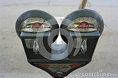 Coin parking meter showing 'Time expired' in crescent windows Stock Photo