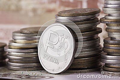 Coin ruble on the background of banknotes and money stacks Stock Photo