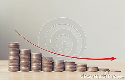 Coin stack step down graph with red arrow, Risk management business financial and investment, Copy space Stock Photo