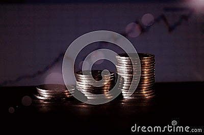 Coin steps with blue graphic blurred background Stock Photo