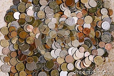 Coin texture. Coins from different countries. A big pile of pennies. Stock Photo