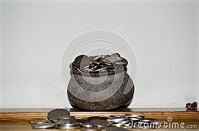 The Coins from around the world in the old black pottery isolated for collecting, business concept , Save money concept Stock Photo