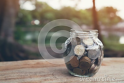 Coins in the bottle, Money growing concept and the goal success. Stock Photo