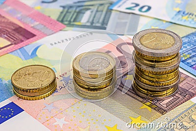 Coins Chart on Euro Banknotes Stock Photo