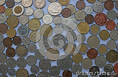 Coins of different currencies laying next to eachother - Euro, Bath, dollar, pound and more Stock Photo