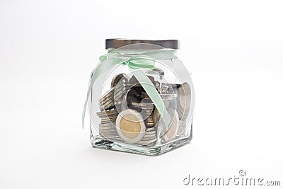 Coins in the Glass Bottle on iSolated White Background, Saving Money Concept Stock Photo