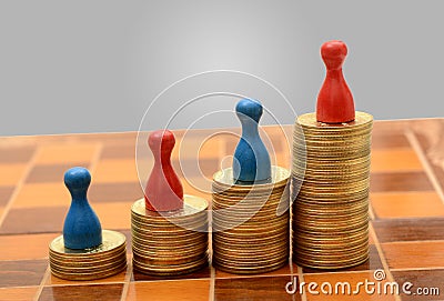 Coins Gold Pile with Pawns graph of success concept Stock Photo