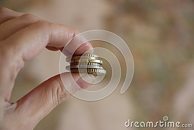 Coins in hand. Color toned image. Little money or small business concept Stock Photo