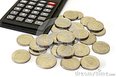 Coins 1 and 2 hryvnia and part of the calculator on a white background. Business concept. Ukrainian money on white. Close-up. Stock Photo