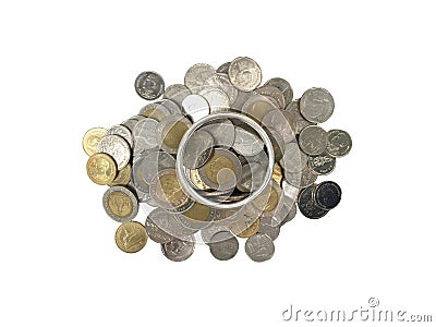 Coins inside silver glass on coins pile for saving or business concept on white background. Stock Photo