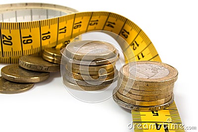 Coins with metre on white Stock Photo