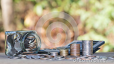 Coins or money on calculators, financial accounting concepts. Stock Photo