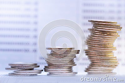 Coins stacking on bank passbook. Retirement planning. Investment and money saving. Stock Photo