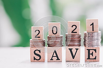 Coins stacks and Text of save and 2021 number Stock Photo