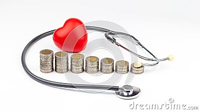 Coins, stethoscope and red heart ,Saving money for Medical expenses and Health care concept Stock Photo