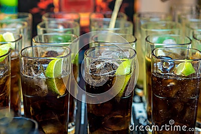 Cola / Rum / Whiskey Glasses with Ice Cubes Stock Photo