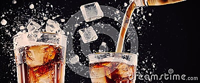 Cola soda and ice splashing fizzing or floating up to top of surface Stock Photo