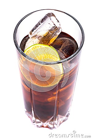 Cola in tall glass with ice cubes and lime Stock Photo