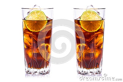 Cola in tall glasses with ice cubes and lime Stock Photo