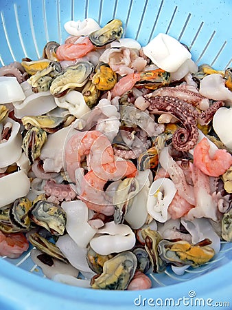 Colander with fresh seafood Stock Photo