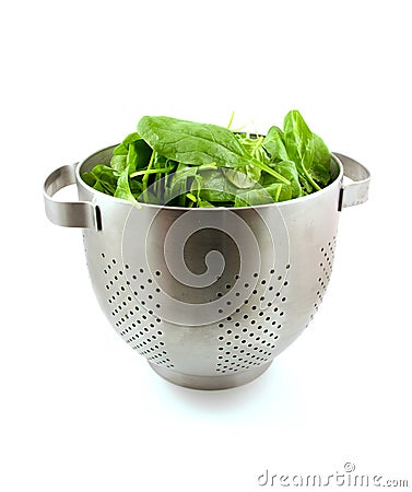 Colander with fresh spinach Stock Photo