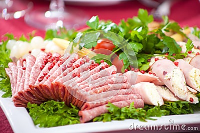 Cold appetizer with ham, cheese and fresh salad Stock Photo