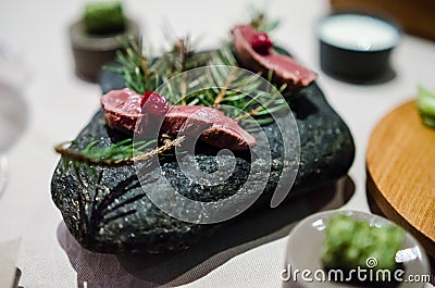 Cold appetizer with rare grilled lamb heart Stock Photo