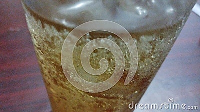 Cold beer in a glass on the table. Close-up. close up of a glass of beer with foam and bubbles Stock Photo