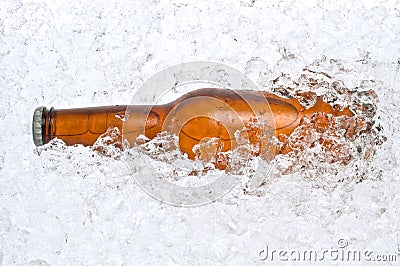 Cold beer nestled in crushed ice Stock Photo