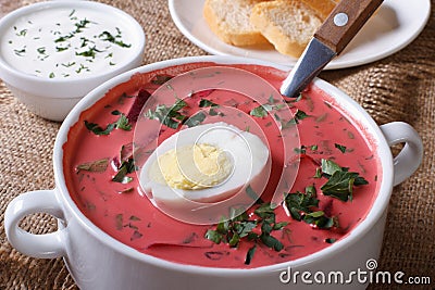 Cold beet soup with egg and herbs closeup. horizontal Stock Photo