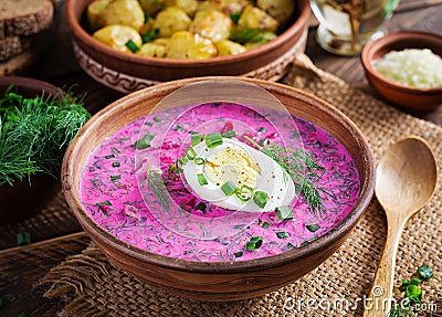 Cold borscht, summer beet soup with fresh cucumber, boiled egg and baked potatoes Stock Photo