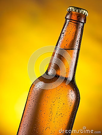 Cold bottle of beer with condensed moisture on it. Stock Photo