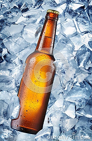 Cold bottle of beer in the ice cubes. Stock Photo