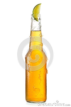 Cold bottle of beer with lime Stock Photo