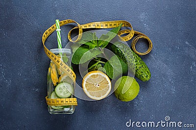 Cold detox water with lemon, cucumber, mint in glass bottle. Organic healthy water for weight loss Stock Photo