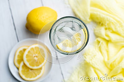 Cold Detox Water with lemon slices and mint on a white wood table Stock Photo