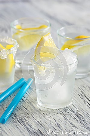 Cold drink with lemon and ice. Cool lemonade. Stock Photo