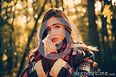 Cold flu season runny nose. Woman with allergy symptoms blowing nose. Portrait Of Young Woman Sniffing Nasal Spray Stock Photo