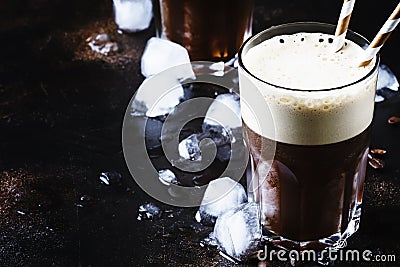 Cold frothy frappe coffee in large glasses on brown background, Stock Photo