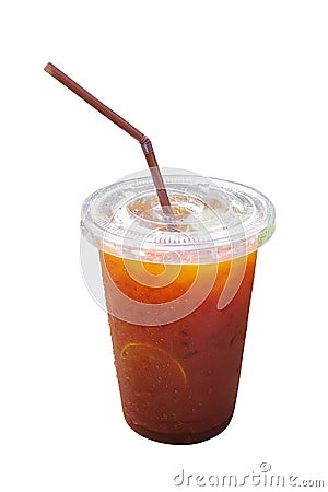 Cold lemon iced tea in take away plastic cup with straw and condensed water droplets on outside surface, summer refreshing drink Stock Photo