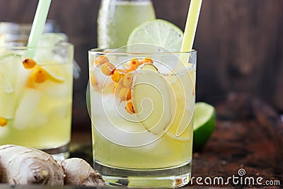 Cold lemonade with ginger, lime and sea buckthorn Stock Photo