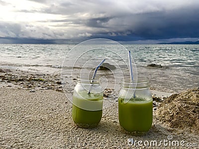 Cold Matcha Latte In the beach Stock Photo