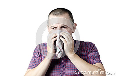 A cold person sneezes into a scarf infected with an infection, an allergy Stock Photo