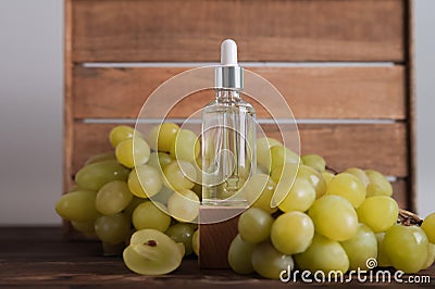 Cold pressed grape oil. Organic bio care products with natural ingredients. Close-up grapes and copy space. Halved grapes and grap Stock Photo