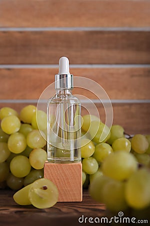 Cold pressed grape oil. Organic bio care products with natural ingredients. Close-up grapes and copy space. Halved grapes and grap Stock Photo