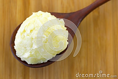 Cold pressed unrefined Shea butter fat extracted from nut seed o Stock Photo