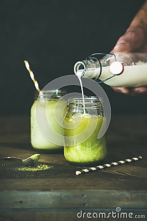 Cold refreshing summer iced coconut matcha latte drink Stock Photo