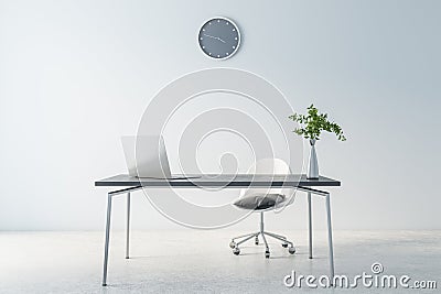 Cold shadows interior design of home office waork place with modern laptop on dark marble table, grey wall clock on light Stock Photo