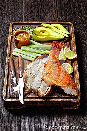 Cold smoked red snapper on a cutting board Stock Photo
