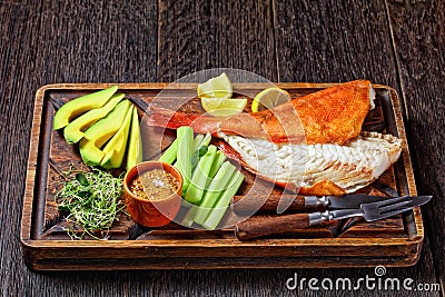 Cold smoked red snapper on a cutting board Stock Photo